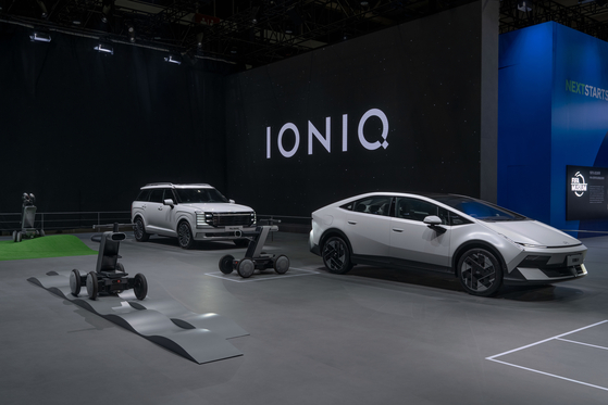 The Palisade, left, and Ioniq V are displayed at Hyundai Motor's booth at Auto China 2026 in Beijing on April 24. [HYUNDAI MOTOR]