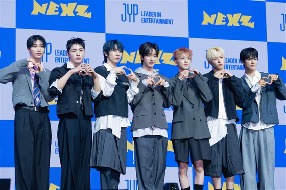 Boy band NEXZ poses for photos during a press showcase for its single, ″Mmchk,″ held at Blue Square Woori WON Banking Hall in Yongsan District, central Seoul, on April 27. [DANIELA GONZALEZ PEREZ] 