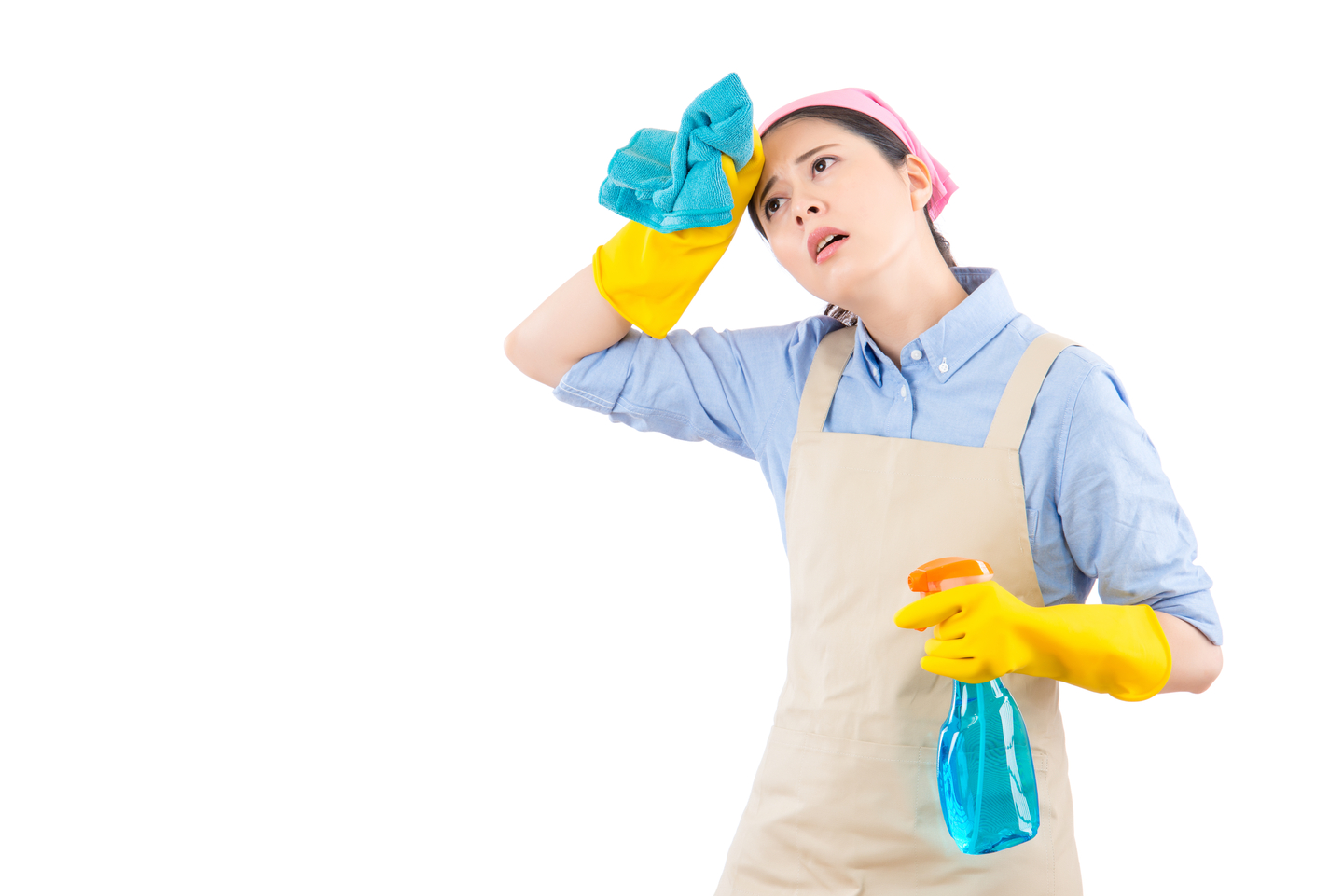 A woman wipes away sweat while cleaning [SHUTTERSTOCK]