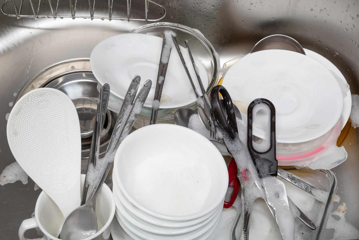 An image of dishes ready to be washed in the sink [YONHAP]